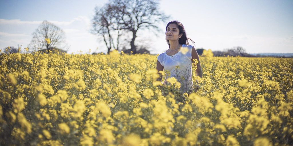 Deepa in flowers field